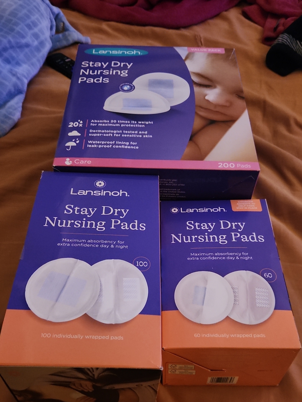 3Lansinoh Stay Dry Nursing Pads - Purple & Peach Packaging 360 Total